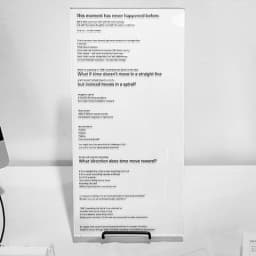 Tall plaque titled TIME: Unwinding the Spiral with text about time as a spiral.
