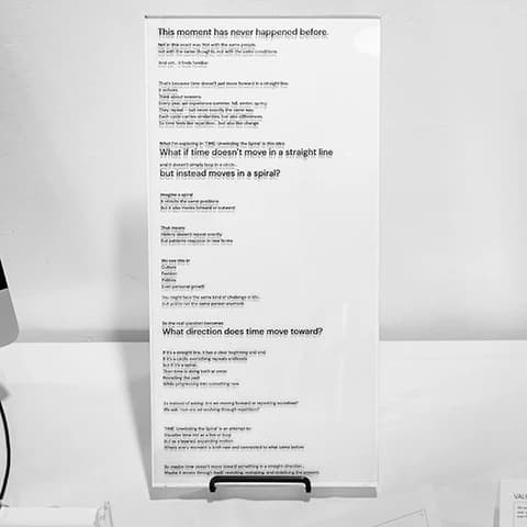 Tall plaque titled TIME: Unwinding the Spiral with text about time as a spiral.